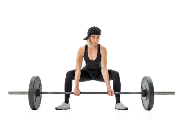 Young woman doing deadlift with a barbell isolated on white — Stock Photo, Image