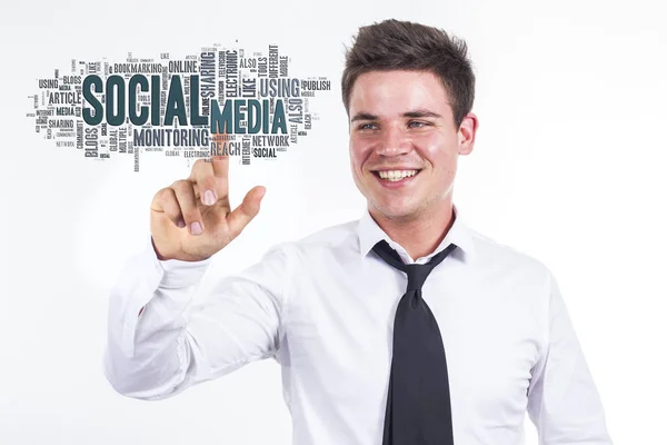 Mídia social - Jovem empresário tocando nuvem de palavras — Fotografia de Stock