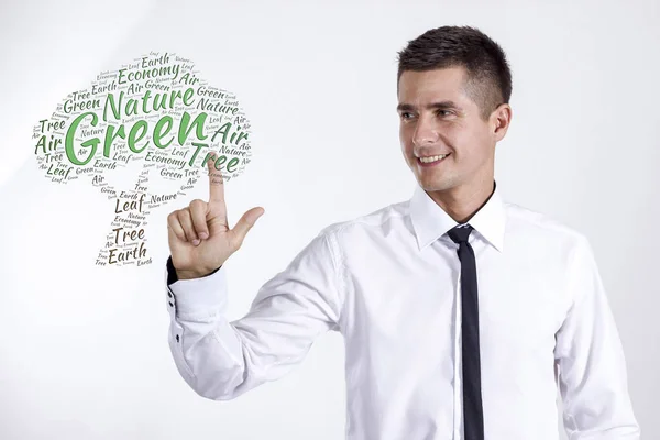 Árvore Verde - Jovem empresário tocando nuvem de palavras — Fotografia de Stock