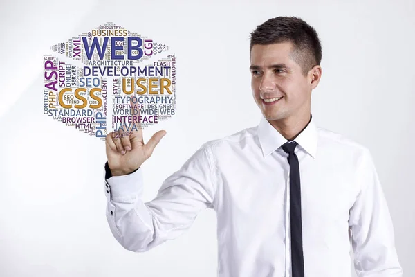 Web development - Young businessman touching word cloud — Stock Photo, Image