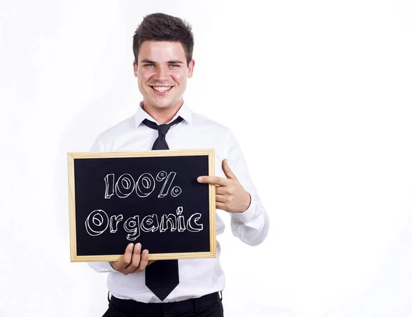 100% orgânico - Jovem sorridente empresário segurando quadro com — Fotografia de Stock