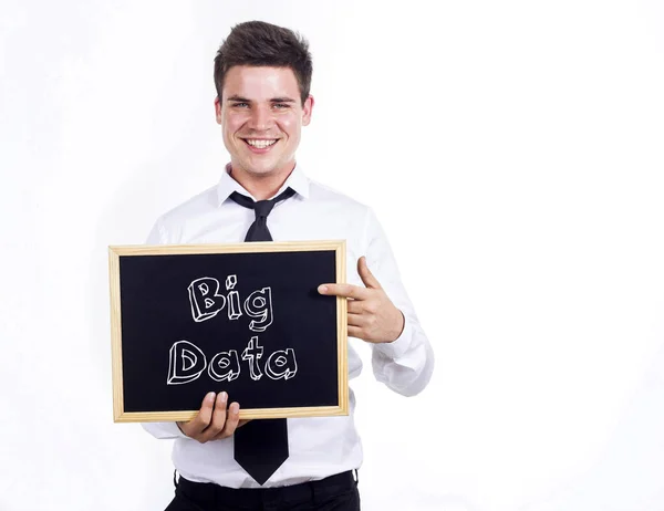 Büyük veri - tex ile kara tahta tutan genç gülümseyen iş adamı — Stok fotoğraf
