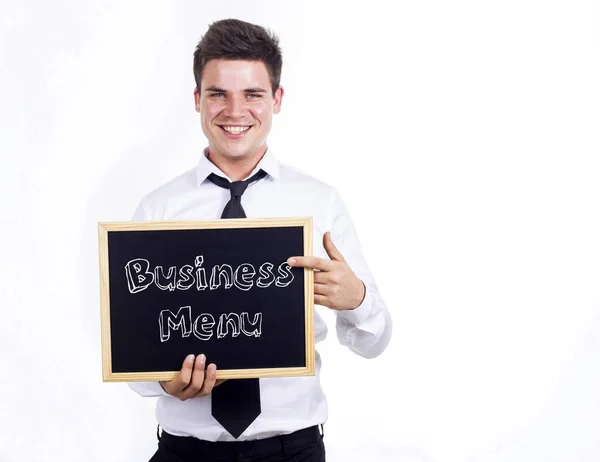 Zakelijke Menu - jonge lachende zakenman schoolbord wit te houden — Stockfoto