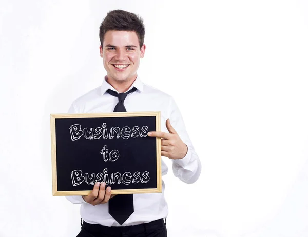 Business-to-Business - jonge glimlachend zakenman bedrijf chalkbo — Stockfoto