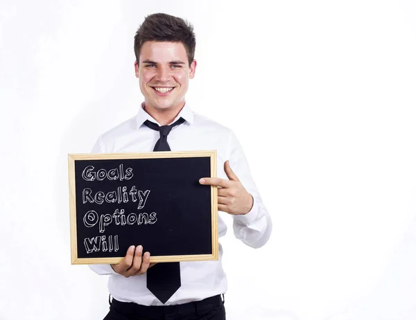 Célok valóság lehetőségek Will Grow - fiatal üzletember mosolygó tart — Stock Fotó