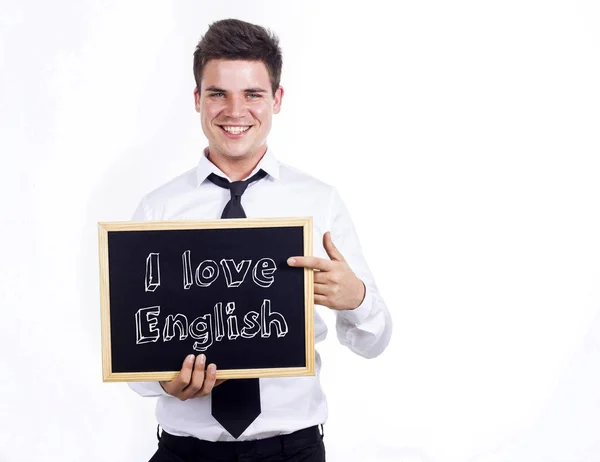 Ik hou van Engels - jonge lachende zakenman schoolbord te houden wi — Stockfoto