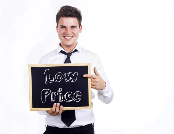 Low Price - Young smiling businessman holding chalkboard with te — Stock Photo, Image