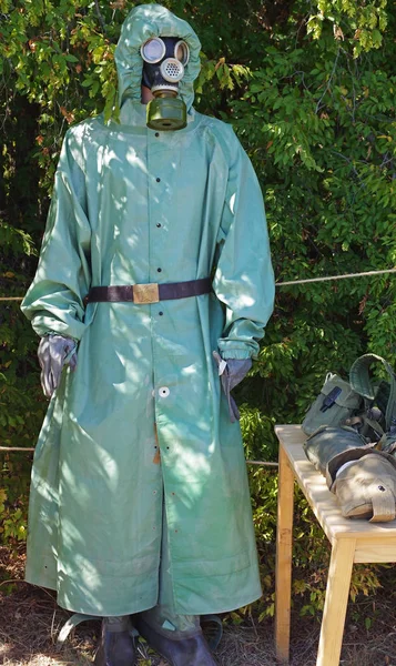 model of a soldier in a gas mask and chemical protection suit