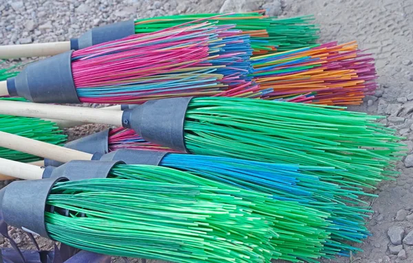 colorful plastic brooms for cleaning the territory