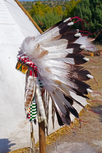 Indian hat with feathers at the exhibition