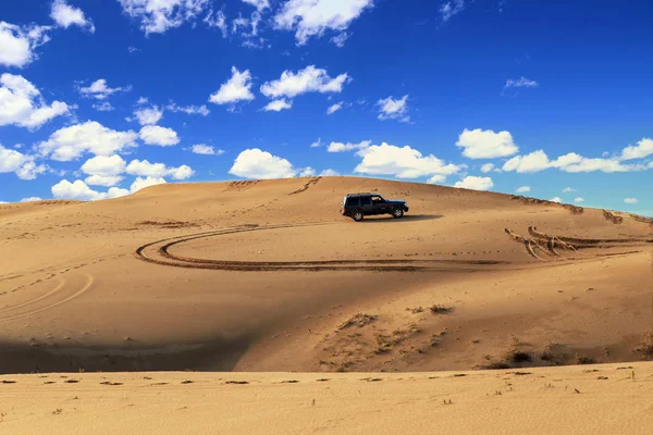 An suv in the desert