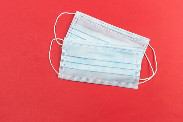 A close-up shot of a disposable surgical mask