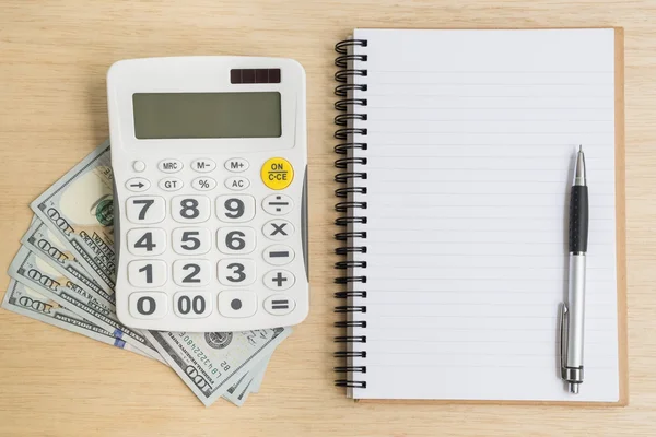 Top view of notebook calculator cash — Stock Photo, Image