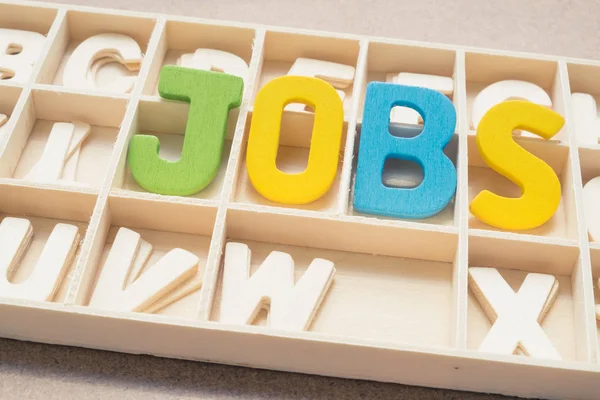 Colorful Jobs wording in wooden box