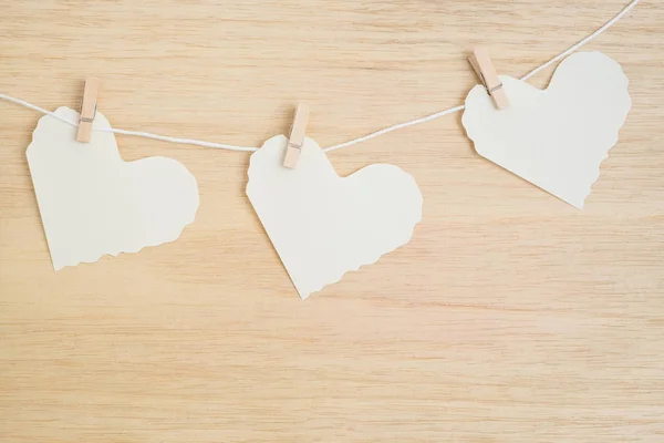 Three paper hearts on wooden background — Stock Photo, Image