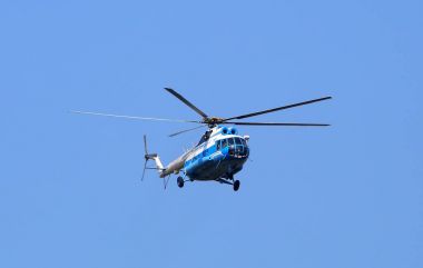 Walking helicopter in the sky, St. Petersburg, Russia, July 2017 clipart
