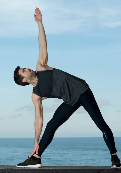 Young man practices pilates — Stock Photo, Image