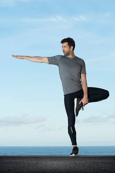 Young man practices yoga space for text — Stock Photo, Image