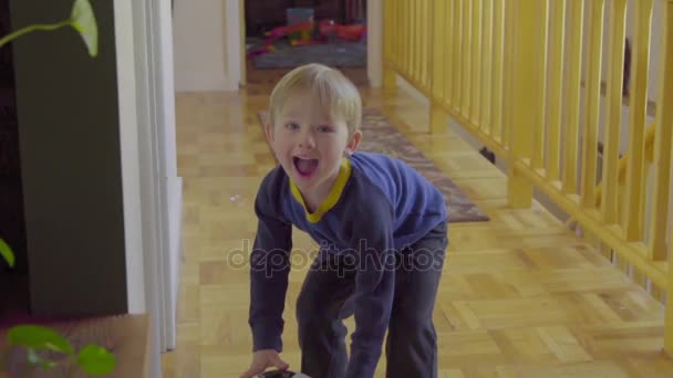 Menino rolando na bola de futebol — Vídeo de Stock