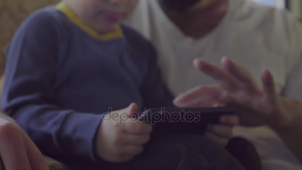 Son and father using smartphone — Stock Video