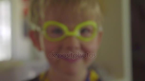 Cute boy in yellow goggles — Stock Video