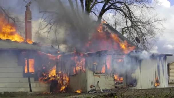 Fire billowing inside a wooden house — Stock Video