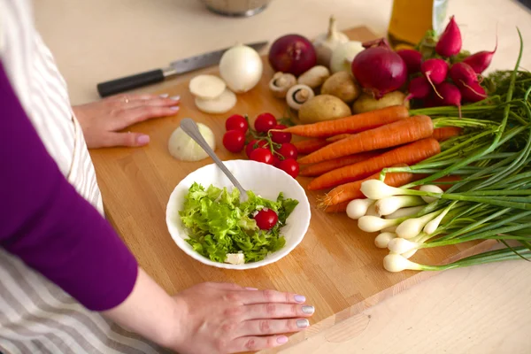 Young Woman Cooking in the kitchen. Healthy Food — Stock Photo, Image