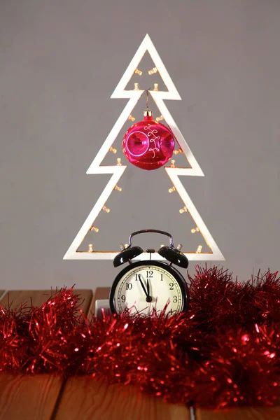 Christmas composition with  tree and clock on the table — Stock Photo, Image