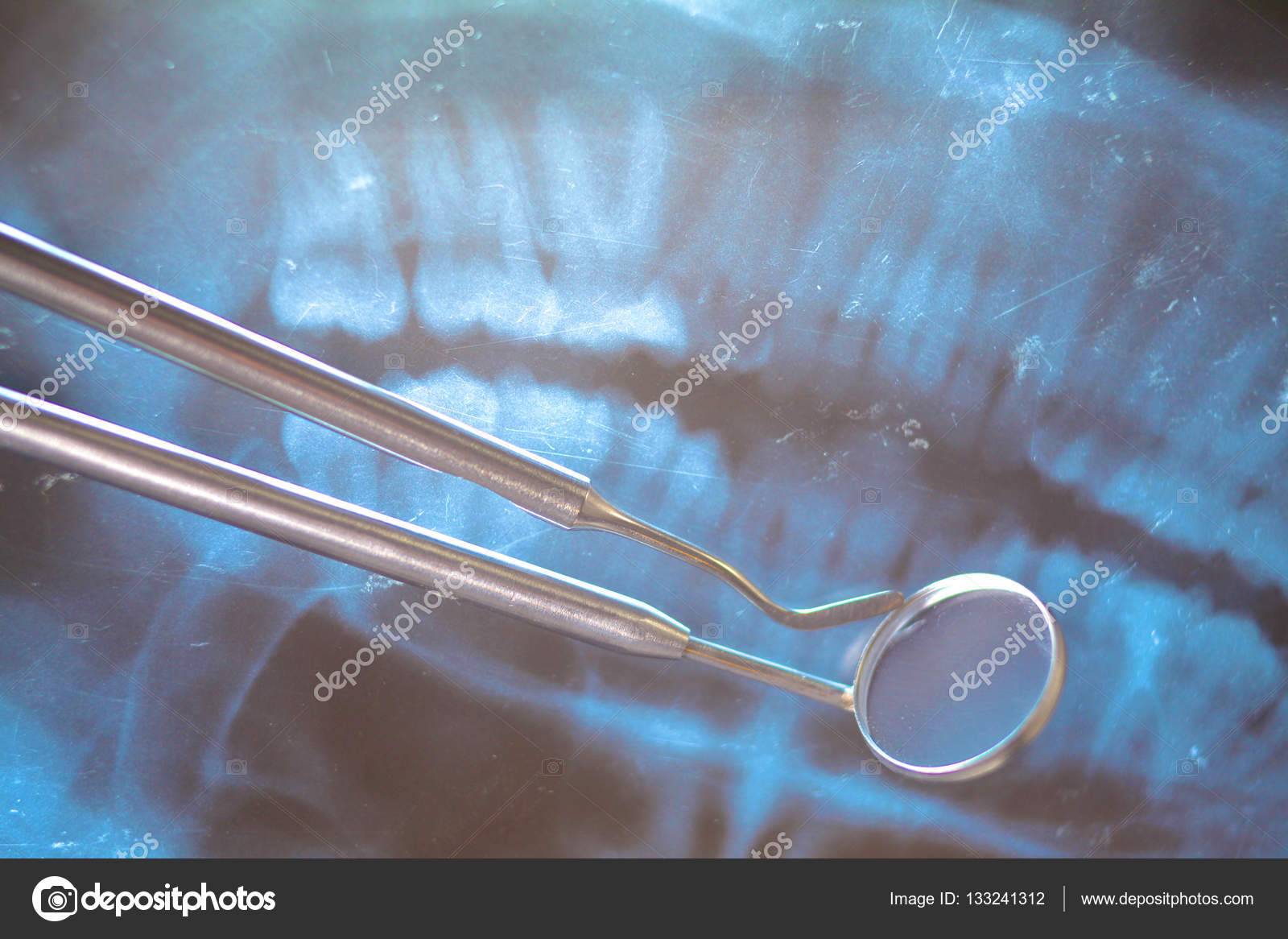 Dental pan xray, denture and instruments Stock Photo by ©lenecnikolai 133241312