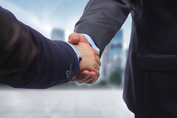 Business handshake. Two businessman shaking hands with each othe