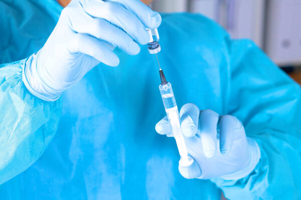 Syringe in the hands of the doctor, close-up Stock Picture