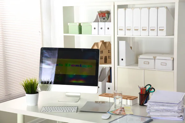 Office desk with a computer and stack of papers — Stock Photo, Image