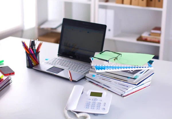 A note book, laptop, pen, graph paper document on the office desk table behind white blind — Stock Photo, Image