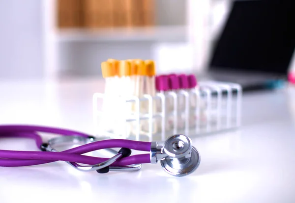 Stethoscope near medical tubes on white background — Stock Photo, Image