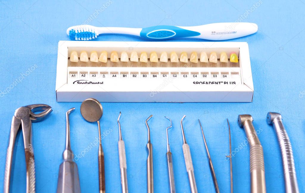 surgical instruments and tools including scalpels, forceps and tweezers arranged on a table for a surgery