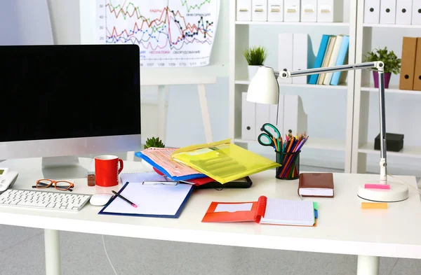 Office table with blank notepad and laptop — Stock Photo, Image