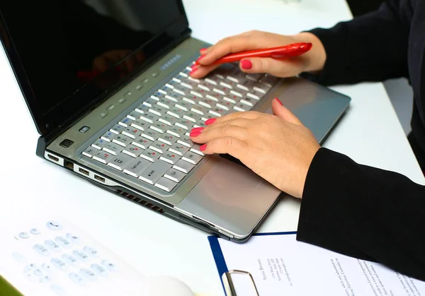 the woman behind the desk in the Office