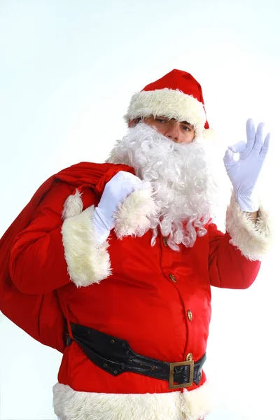 Papai Noel correndo com o saco dos presentes — Fotografia de Stock