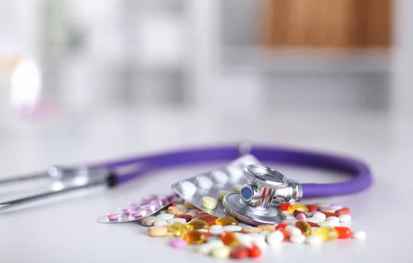 Pharmacy background on a white table. Tablets on a white background. Pills. Medicine and healthy