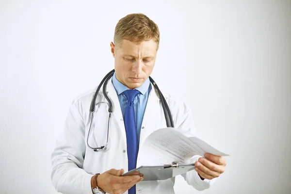 Young confident doctor in a white coat with a stethoscope — Stock Photo, Image