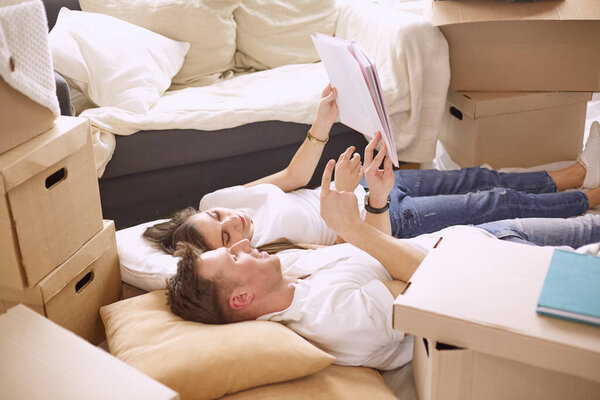 Young Vietnamese family looking through family photo album