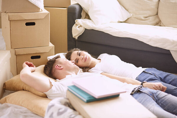 Young Vietnamese family looking through family photo album