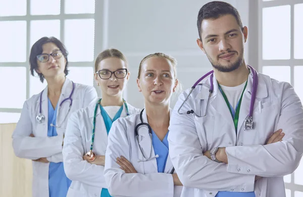 Smiling team of doctors and nurses at hospital — Stock Photo, Image