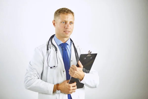 Young confident doctor in a white coat with a stethoscope — Stock Photo, Image