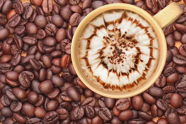 hot late art coffee on coffee beans background