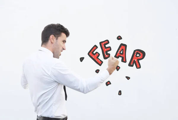 Strong businessman punching to win over his fear and then start taking action. Take risk concept. Stock image. — Stock Photo, Image