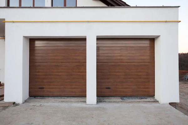 Double brown garage door in a new house. — Stock Photo, Image