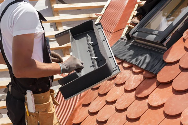 Installation of mansard windows on a new roof of red tiles. — Stock Photo, Image