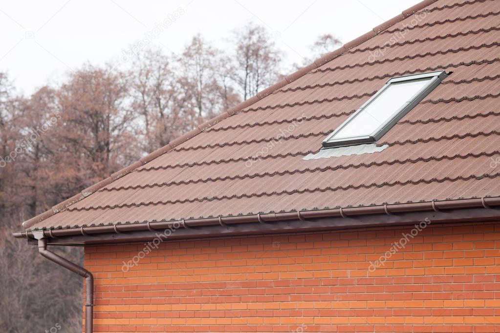  Stone Coated Metal tile Roof with skylights and rain gutter.
