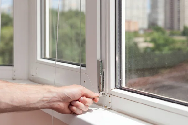 Handyman Repairs Plastic Window Hexagon Workman Adjusts Operation Plastic Window — Stock Photo, Image